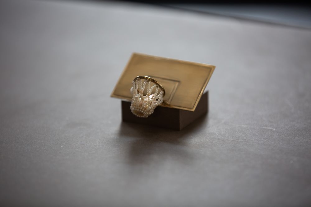 A basketball hoop made of gold and pearls