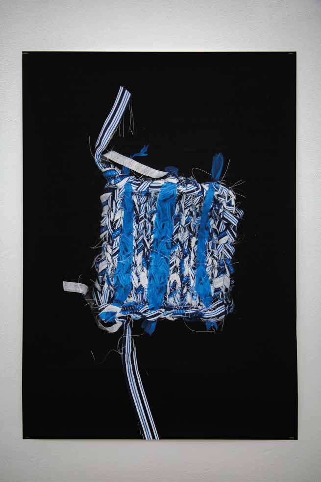 Textile knitted sample hung in a gallery space