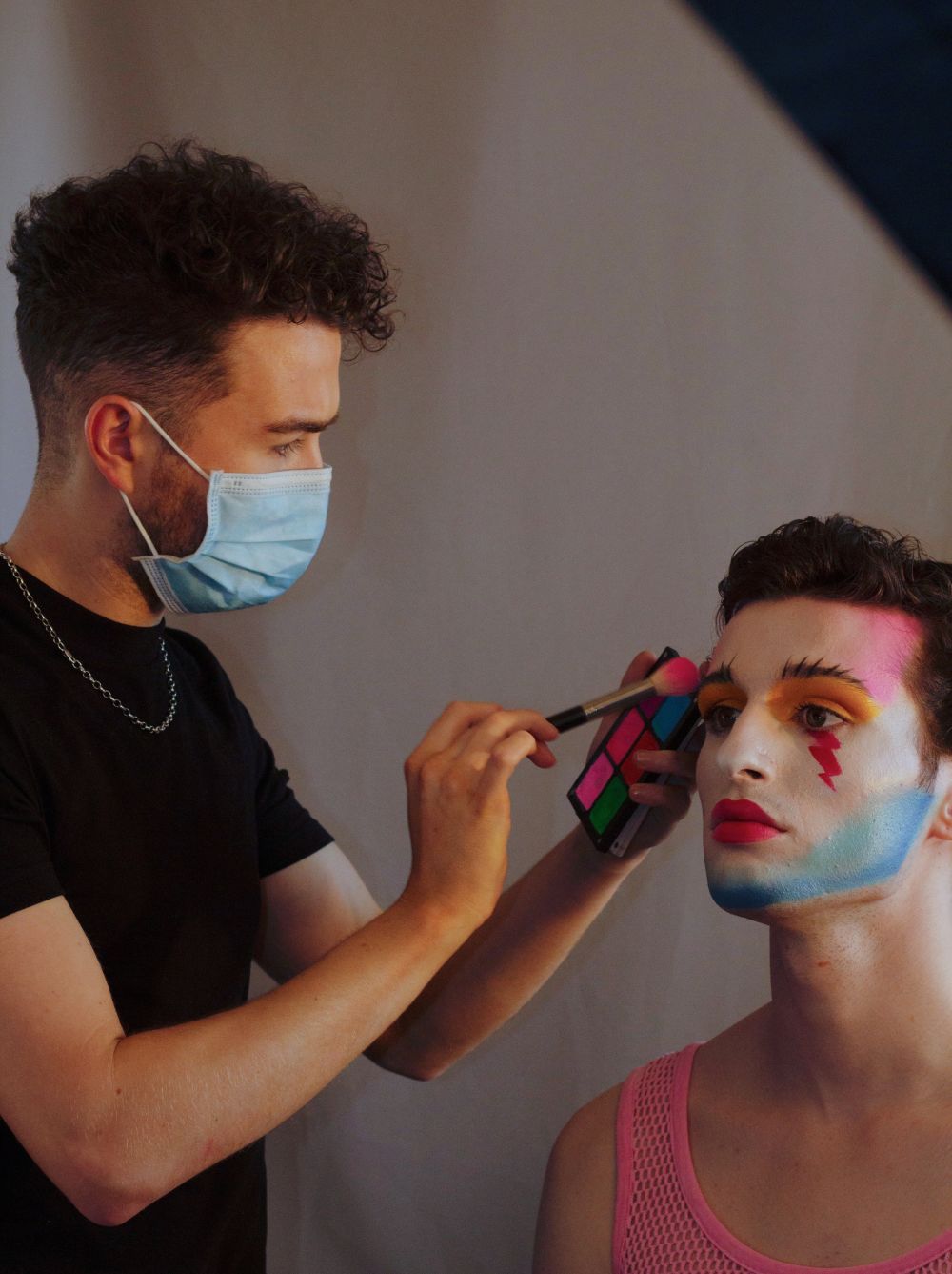 Craig putting makeup on a model
