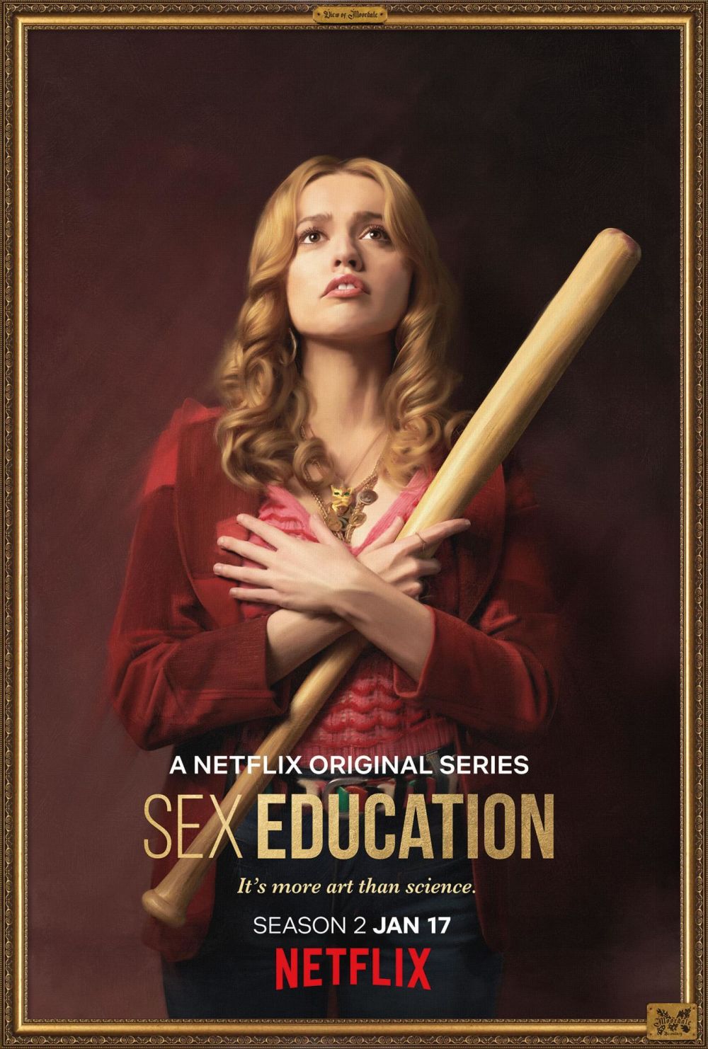 A promotional portrait of Aimee from the Netflix series, Sex Education, holding a baseball bat.