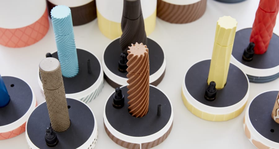 
                                        Colorful textured sticks, attached to black bases
                                        