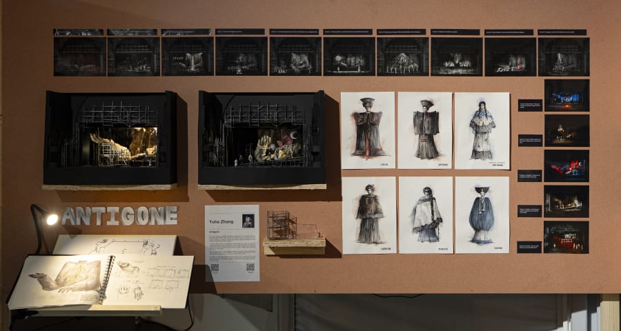 Sketches and a model of a theatre stage attached to a brown board