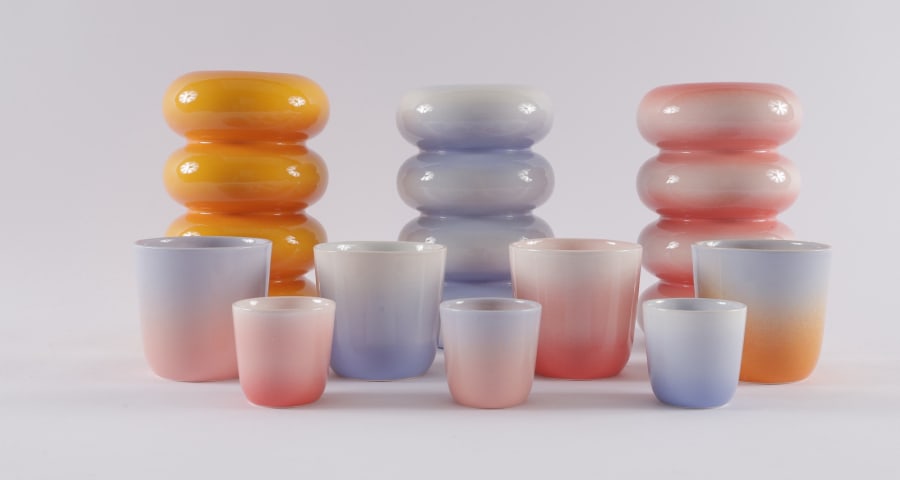 Display of colourful glazed ceramic tableware