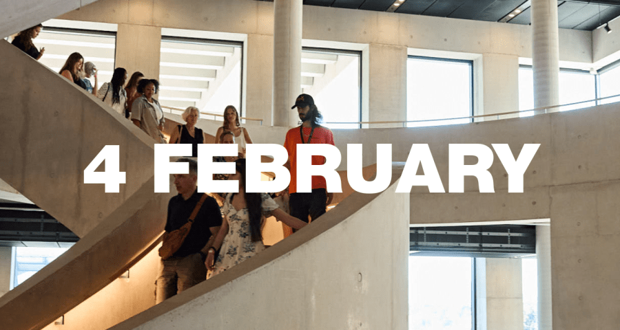 A tour group walking down LCF's main staircase.
