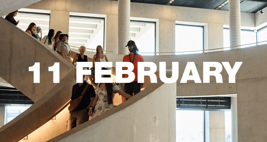 A tour group walking down LCF's main staircase.