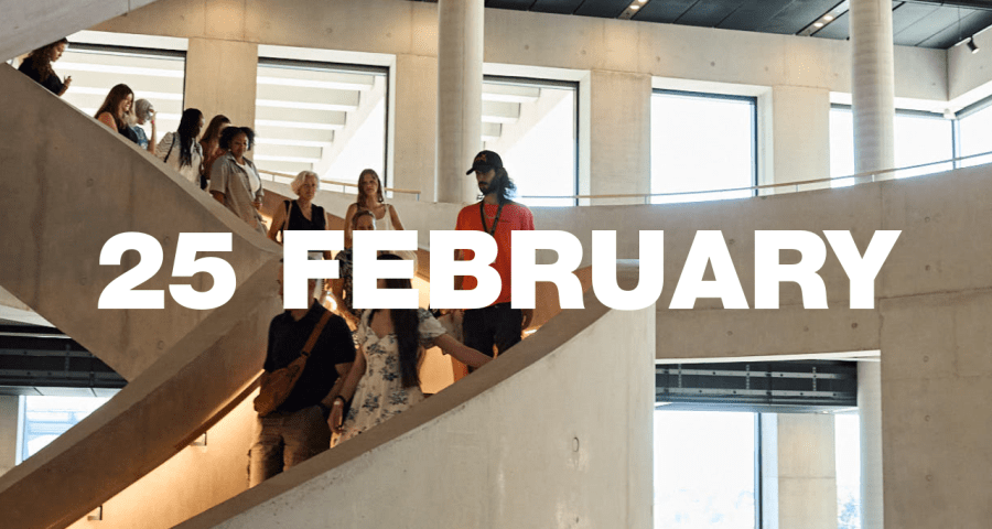 A tour group walking down LCF's main staircase.