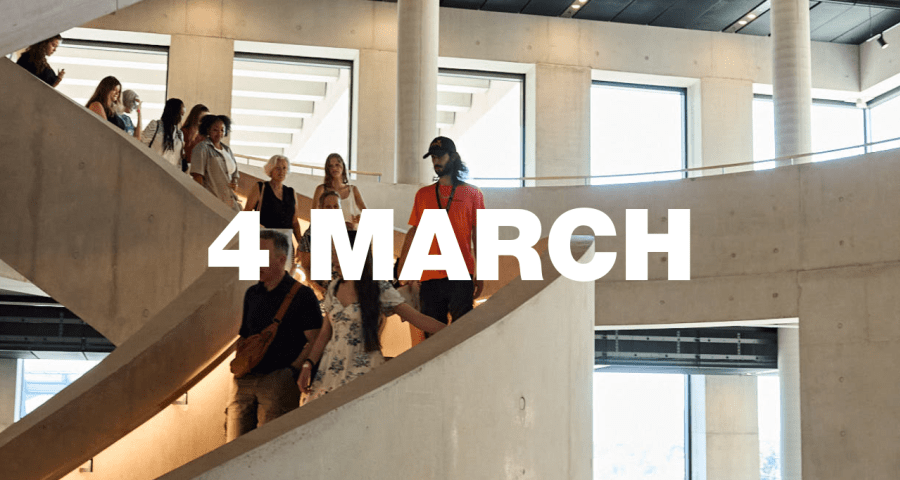 A tour group walking down LCF's main staircase.