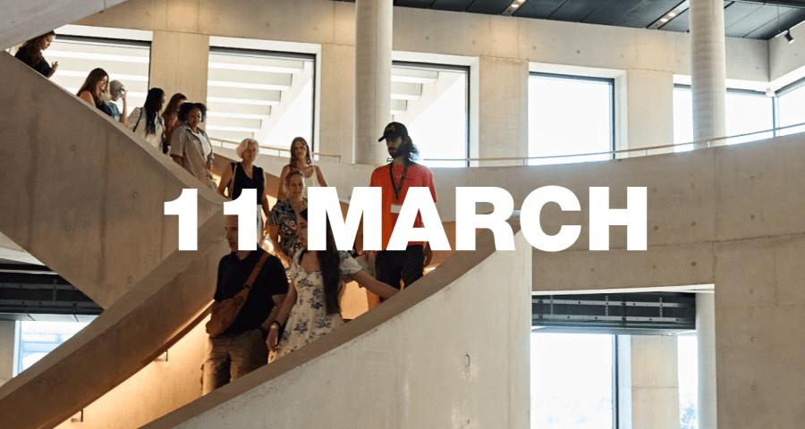 A tour group walking down LCF's main staircase.