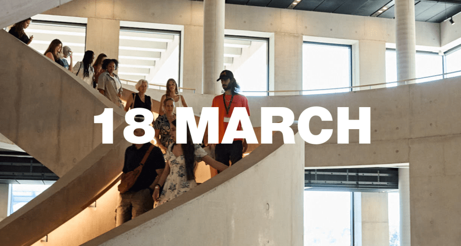 A tour group walking down LCF's main staircase.