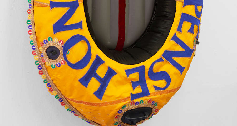 Yellow boat with blue lettering on it