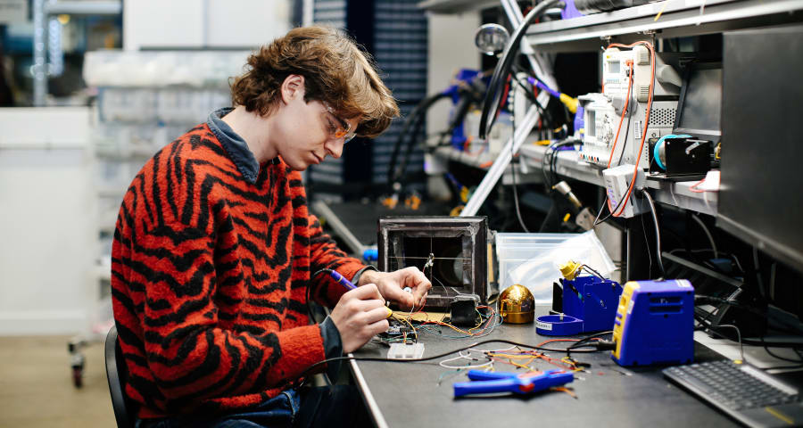 Josef Murmann soldering in the Physical Computing Lab